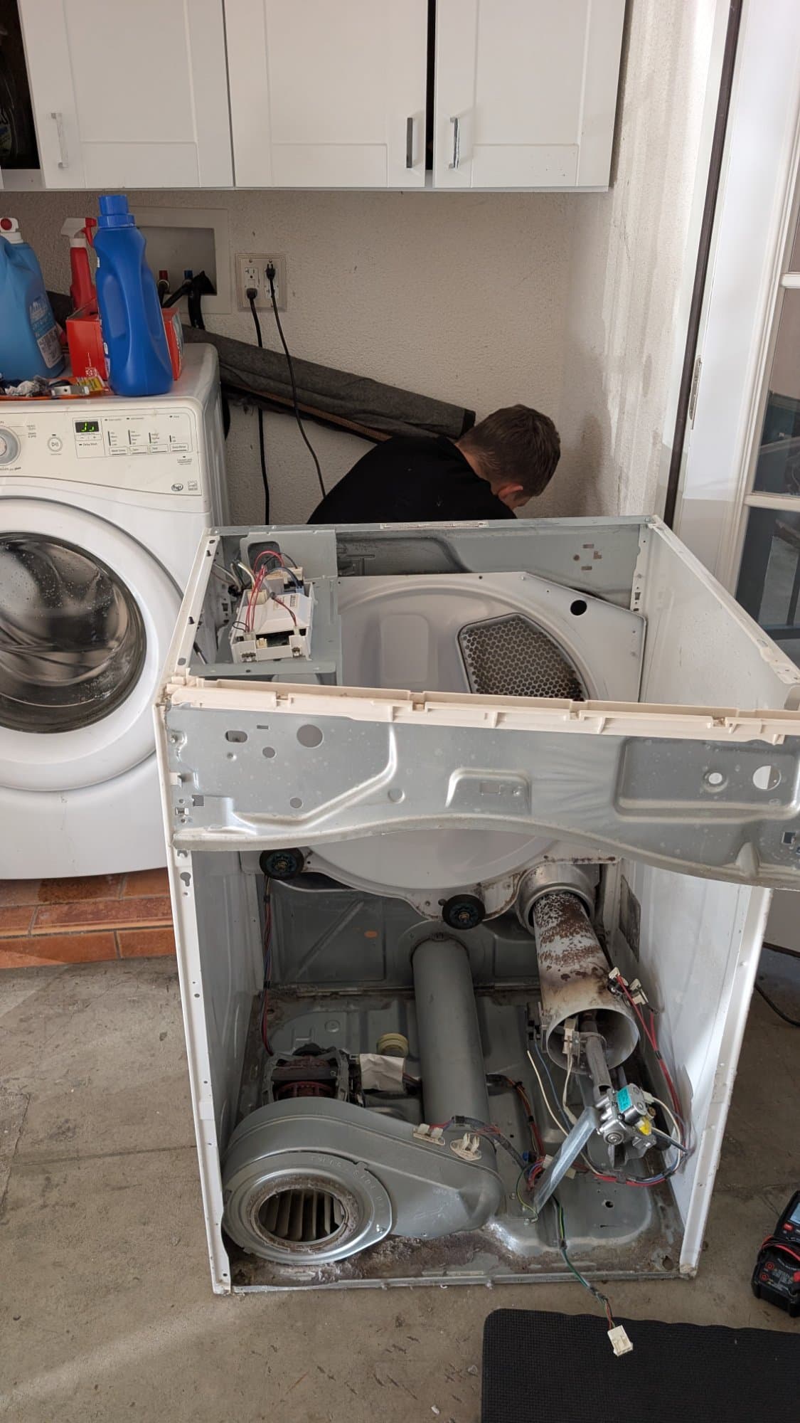Dryer fully disassembled for comprehensive repair